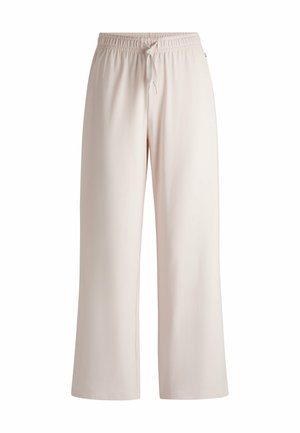 Lys rosa, brede benbukser lavet af blødt stof, med elastisk talje og snor. Enkel design uden mønstre eller accenter.