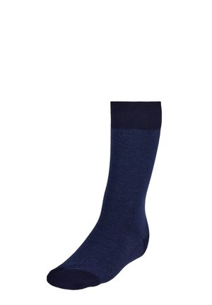 Navy blue sock with a ribbed top band, textured body, and seamless toe design. It tapers towards the toe for a fitted shape.