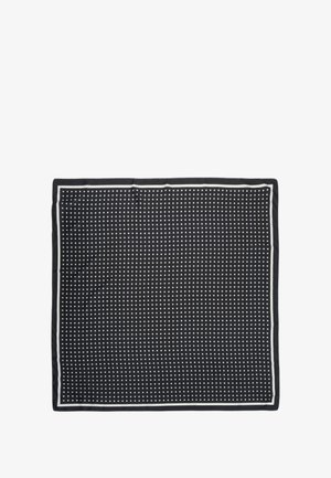 Black square scarf with a white dotted pattern and thin white border, laid flat with slight wrinkles.