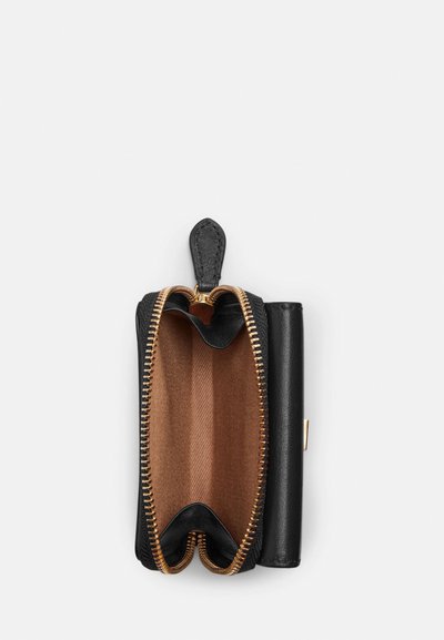 Black leather wallet with a gold zip, featuring a brown textured interior and a simple tab closure. The interior has a striped pattern.