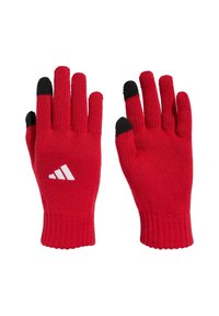 Par rukavice od crvenog pletenog materijala s crnim vrhovima na palcu i kažiprstu, s bijelim Adidas logotipom na stražnjoj strani lijeve rukavice.