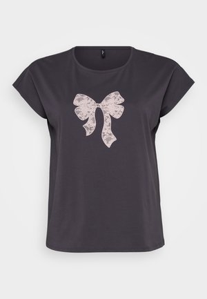 Dark gray T-shirt with short sleeves, featuring a light pink lace bow graphic at the center. Smooth fabric, relaxed fit, rounded neckline.