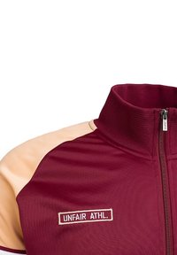 UNFAIR ATHLETICS Užtrauktuku užsegamas treningas - burgundy peach