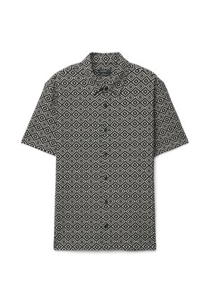 Chemise à manches courtes boutonnée en noir et blanc avec un motif géométrique en forme de losange et un col, posée à plat sur un fond blanc.