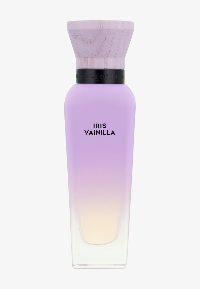 Flacon de parfum en verre haut avec un dégradé du lavande au beige pâle, avec un large bouchon en bois clair et une bande noire, étiqueté "Iris Vainilla".