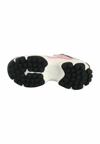 Black rubber sole with circular grip treads, white midsole, and highlights of pink and blue accents on a sneaker design.