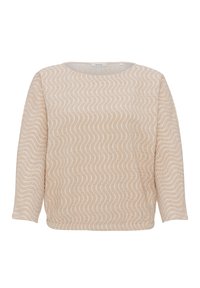 Haut beige à manches longues avec un motif blanc ondulé. Léger, col rond et coupe décontractée, avec un tissu texturé et des coutures latérales.