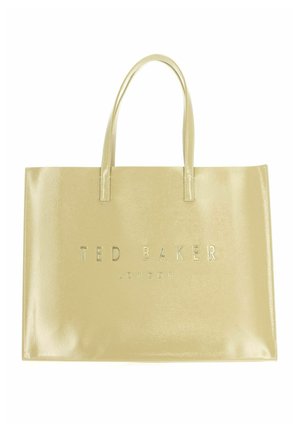Sac cabas beige brillant Ted Baker London avec deux poignées et une forme rectangulaire sur fond blanc.