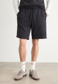 HUGO - DISTRELL - Tracksuit bottoms - black Thumbnail Image 1