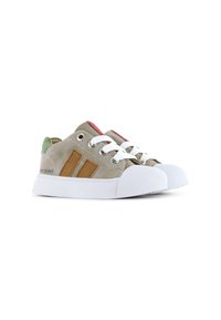 Sneakers in beige with white soles, featuring green and red accents, a textured upper, and brown stripes on the side. Cotton laces.