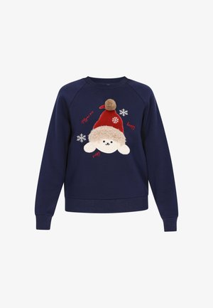 Laivastonsininen collegepaita, jossa pehmeä lampaan kuvio, jolla on punainen hattu ja tupsu. Sisältää kirjailun ja lumihiutalekoristeet.