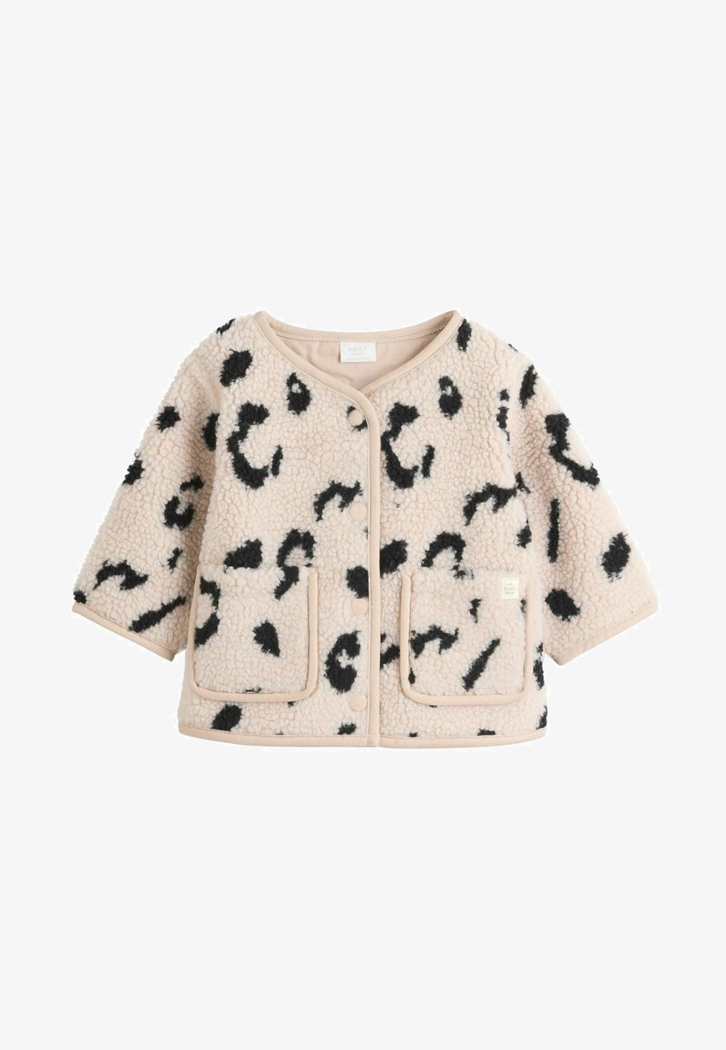 Veste beige douce pour tout-petit avec des taches noires irrégulières, boutons-pression, deux poches avant et manches longues en texture polaire.