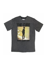 Black graphic t-shirt featuring "THE CURE" and "BOYS DON'T CRY" text. Central image shows a silhouetted figure with guitar against a gradient background.