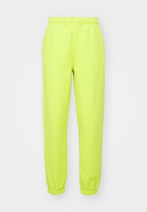 Pantaloni de trening neon verzi, cu talie elastică, manșete tapered și o textură moale și netedă. Potriviți pentru purtare casuală sau pentru exerciții.