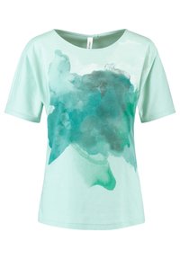 Camiseta de color verde menta claro en algodón suave, con un diseño abstracto de acuarela en azul oscuro en la parte delantera. Mangas cortas y escote redondo.