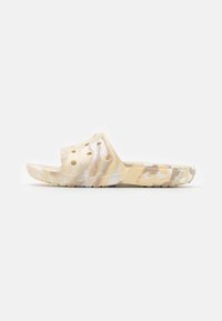 Infradito aperti in beige e bianco maculato, realizzati in materiale leggero, dotati di fori di ventilazione e suola testurizzata per una buona aderenza.