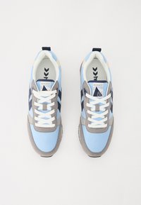 Blue and grey sneakers with a fabric and suede upper, white laces, and navy accents. Features a padded collar and rubber sole.