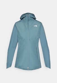 Voděodolná světle modrá bunda s kapucí, předním zipem a dvěma bočními kapsami. Na horní levé části hrudi je logo The North Face.
