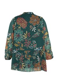 Blouse verte à manches longues avec un grand motif floral coloré dans des tons de rose, bleu, jaune et orange, vue de dos.