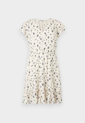 Κρεμ φόρεμα με κοντά μανίκια και μαύρο floral μοτίβο, V-λαιμόκοψη, σούρα στη μέση, κουμπωτό εμπρόσθιο μέρος και βολάν στο στρώσιμο του τελειώματος.