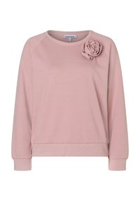Sweatshirt rose clair avec une coupe décontractée, arborant une rose en tissu décorative sur l'épaule gauche et des poignets et un bas côtelés. Texture douce.