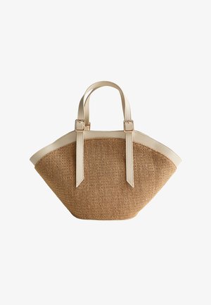 Wiklinowa torebka w kolorze brązowego słomy z kremowobiałą skórzaną lamówką i podwójnymi uchwytami zabezpieczonymi złotymi klamrami.