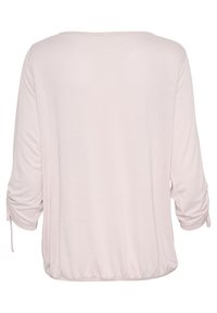 Ljust rosa, löst sittande blus med trekvartslånga ärmar, elastisk midja och dragsnörningsdetaljer vid ärmsluten. Slät tygstruktur.