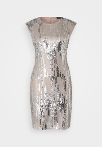 Robe beige sans manches avec des motifs verticaux en sequins argentés et noirs et une fermeture éclair au dos.
