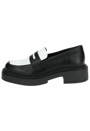 Svart og hvit skinn loafers med rund tå og tykk såle, med et dekorativt svart belte over fronten. Flat hæl.