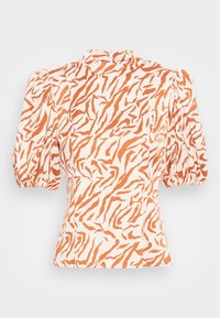 Blusa con maniche a sbuffo in crema chiaro con motivo a strisce arancioni a tigre, tessuto testurizzato, colletto alto e chiusura con zip sul retro.