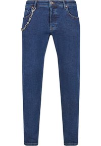 Tummansiniset farkut, joissa on slim fit -leikkaus. Varustettu ketjulla, joka roikkuu etu vyölenkistä, sekä klassisella viiden taskun tyylillä.