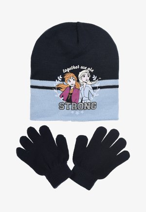Gebreide beanie in marineblauw met lichtblauwe accenten, voorzien van karakters en tekst, gecombineerd met bijpassende marineblauwe handschoenen. Zachte textuur, gezellige uitstraling.