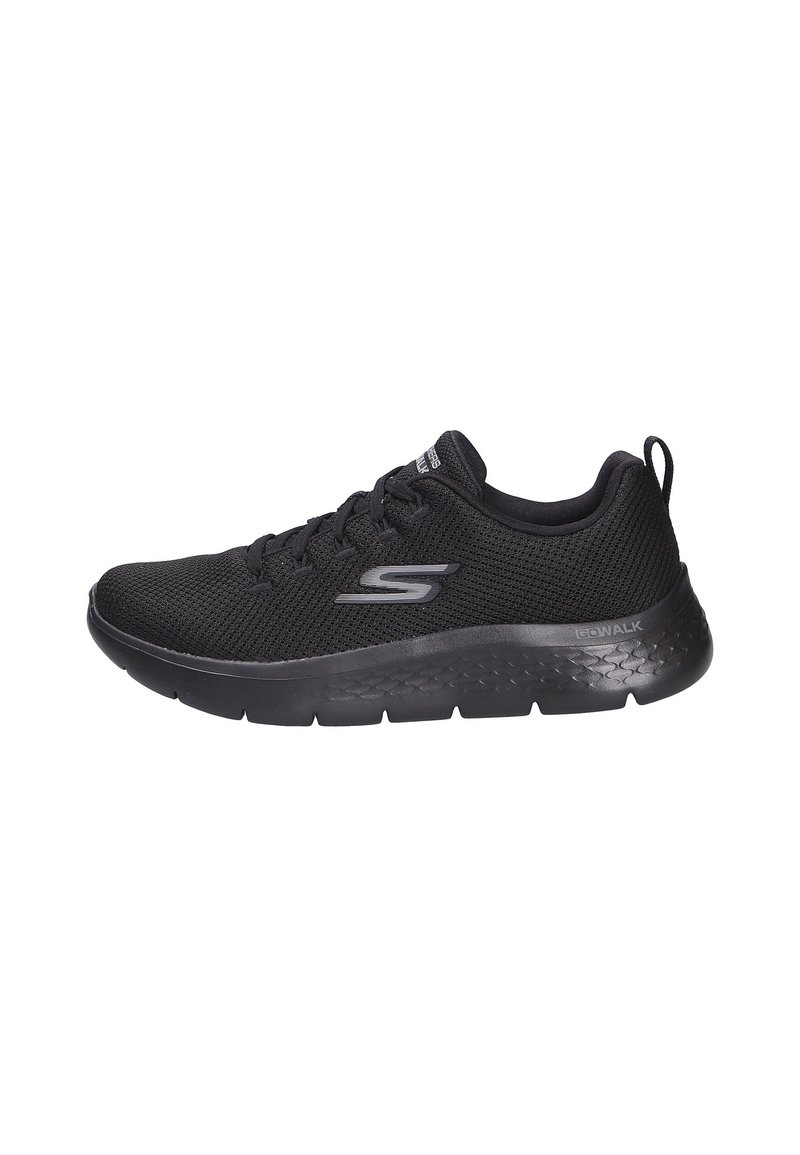 Scarpa sportiva nera con tomaia in rete traspirante, suola spessa e ammortizzata, e dettagli testurizzati sul lato; presenta un design con lacci.