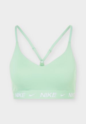 Light green sports bra with thin adjustable straps that cross at the back and white Nike logos on the elastic band below the bust.