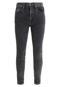 Jeans skinny negros de cintura alta, fabricados con denim de textura desgastada, que presentan un diseño clásico de cinco bolsillos y cierre de cremallera.