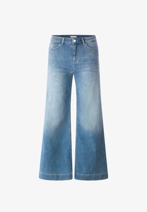 Plaša piegriezuma džinsu bikses gaiši zilā krāsā ar augstu vidukli, piecām kabatām un pakāpenisku izbalējumu. Izgatavotas no mīksta, teksturēta kokvilnas materiāla.