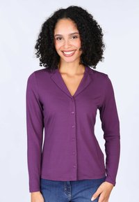 Purple long-sleeve button-up shirt with a shawl collar, made from soft fabric, featuring a front placket with matching buttons and a fitted shape.