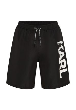 Mustad must- ja elastne vöökoht, nööriga detail ning suure valge "KARL" logo vasakul küljel. Sile ja kerge kangas.