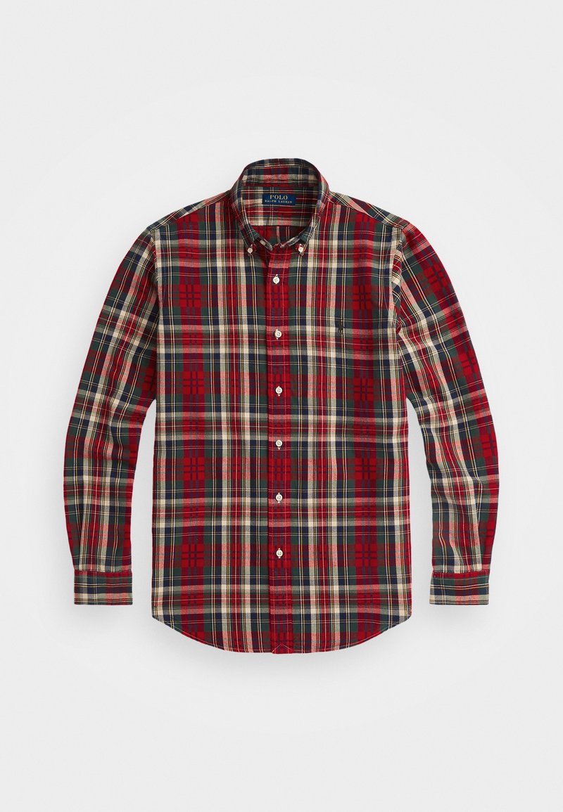 Chemise à manches longues boutonnée avec un motif à carreaux rouge, vert et beige et un col boutonné.