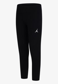 Zwarte legging van stretchstof, met een hoge tailleband en een wit Jumpman-logo op het linkerbeen. Gladde textuur.