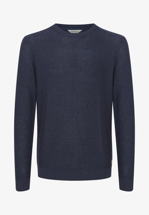 Pulover tricotat de culoare albastru marin, cu guler rotund, mâneci lungi și un model texturat. Finisat cu mansete și tiv din tricot rib.