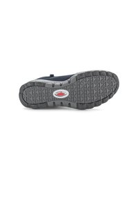 Black shoe sole with textured rubber, featuring a zigzag pattern for grip and a logo badge in red and white.