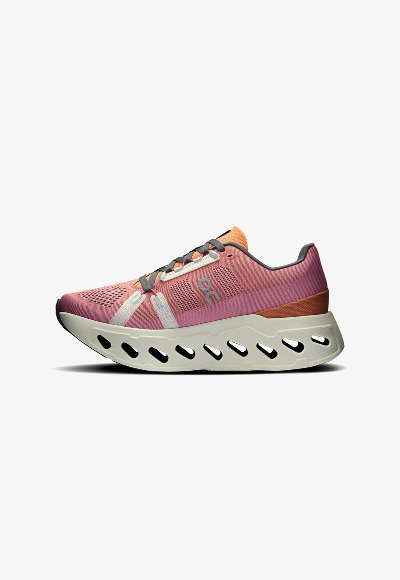 Lightweight running shoe with a pink and peach mesh upper, white accents, and a chunky gray rubber sole featuring cutouts for breathability.
