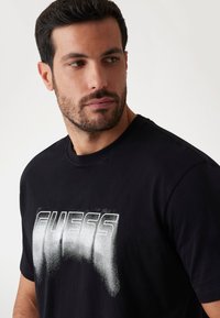 Guess T-shirt con stampa - schwarz