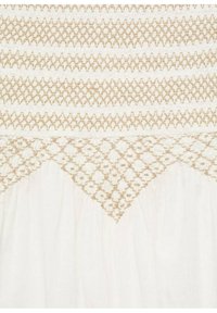 White fabric with horizontal rows of intricate tan smocking; features a diamond pattern at the bottom, showcasing texture and craftsmanship.