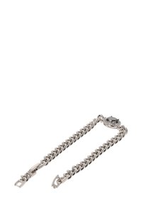 Srebrny metalowy bransoletka z łańcuszka z centralnym czarnym kamieniem, otoczona małymi przezroczystymi akcentami. Zabezpieczone zapięcie po jednym końcu.