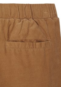 Brown corduroy pants featuring a textured finish with vertical stripes and an elastic waistband. Includes a small back pocket.