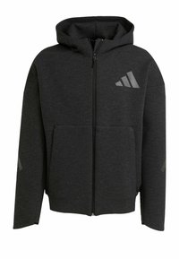 Sweat à capuche noir zippé, fabriqué en tissu doux, avec une poche frontale, des accents de logo discrets et des patchs contrastés aux coudes.
