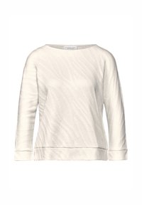 Maglietta a maniche lunghe color crema con scollo a barca, caratterizzata da un motivo testurizzato, orlo e polsini a coste. Realizzata in tessuto morbido.