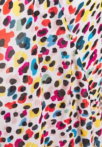 Colorful polyester fabric featuring a vibrant leopard print with black, pink, yellow, blue, and green spots on a white background.